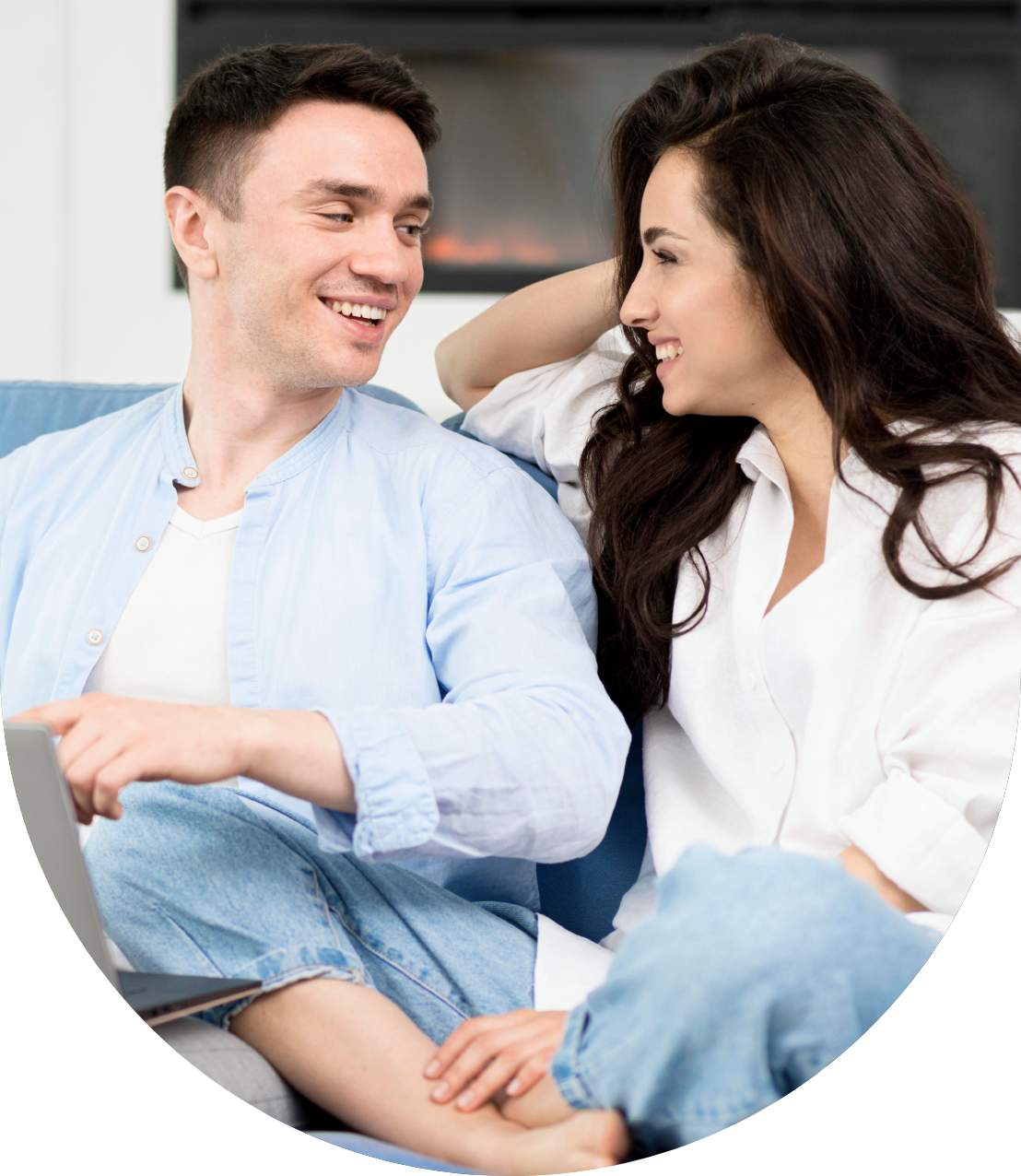 A happy couple smiling and enjoying a conversation together.